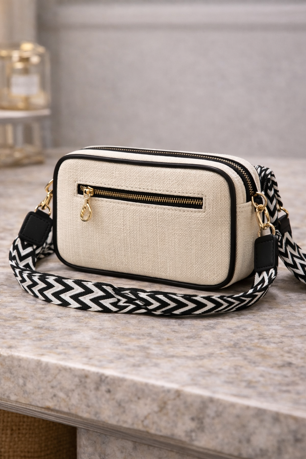 Back view of the black Bagistry DayBreak Sling Bag showing the sleek black lining, inner zipper pocket, and storage capacity.